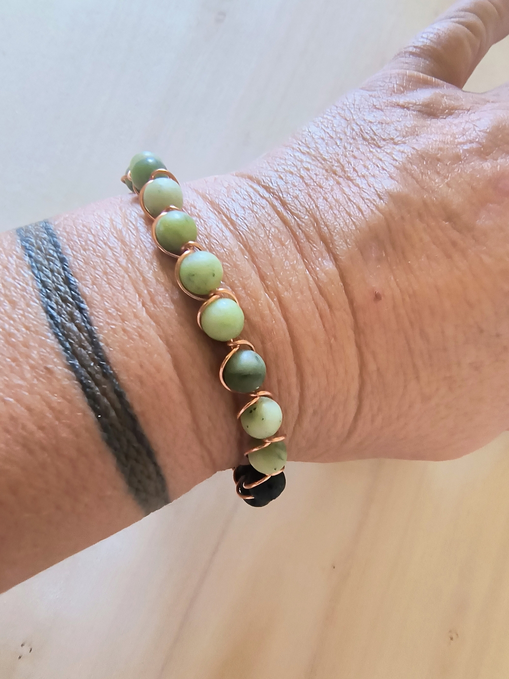 Hand Crafted Green Bead Bracelet with Copper Wrap